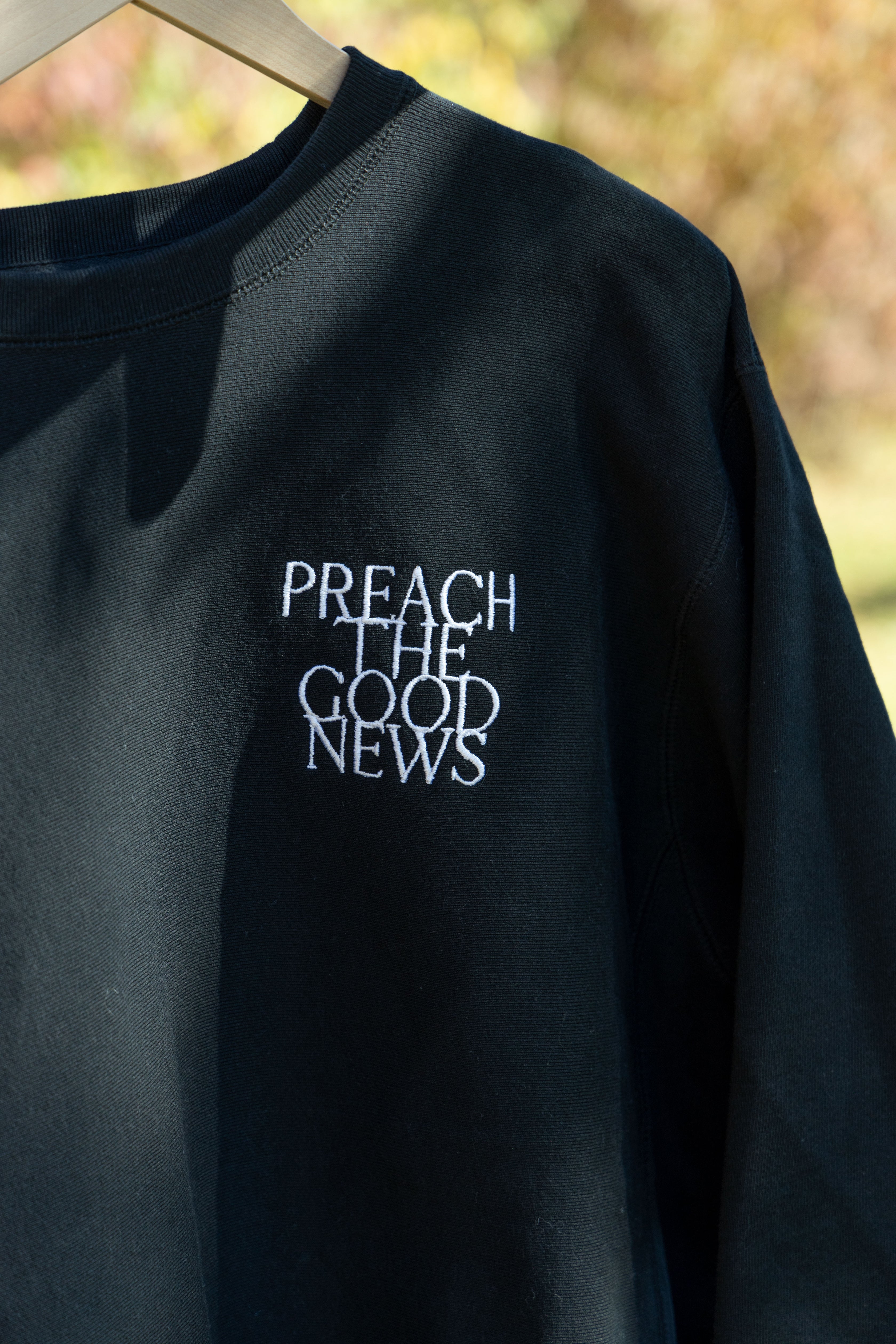 PREACH THE GOOD NEWS PREMIUM CREWNECK black front embroidery detail