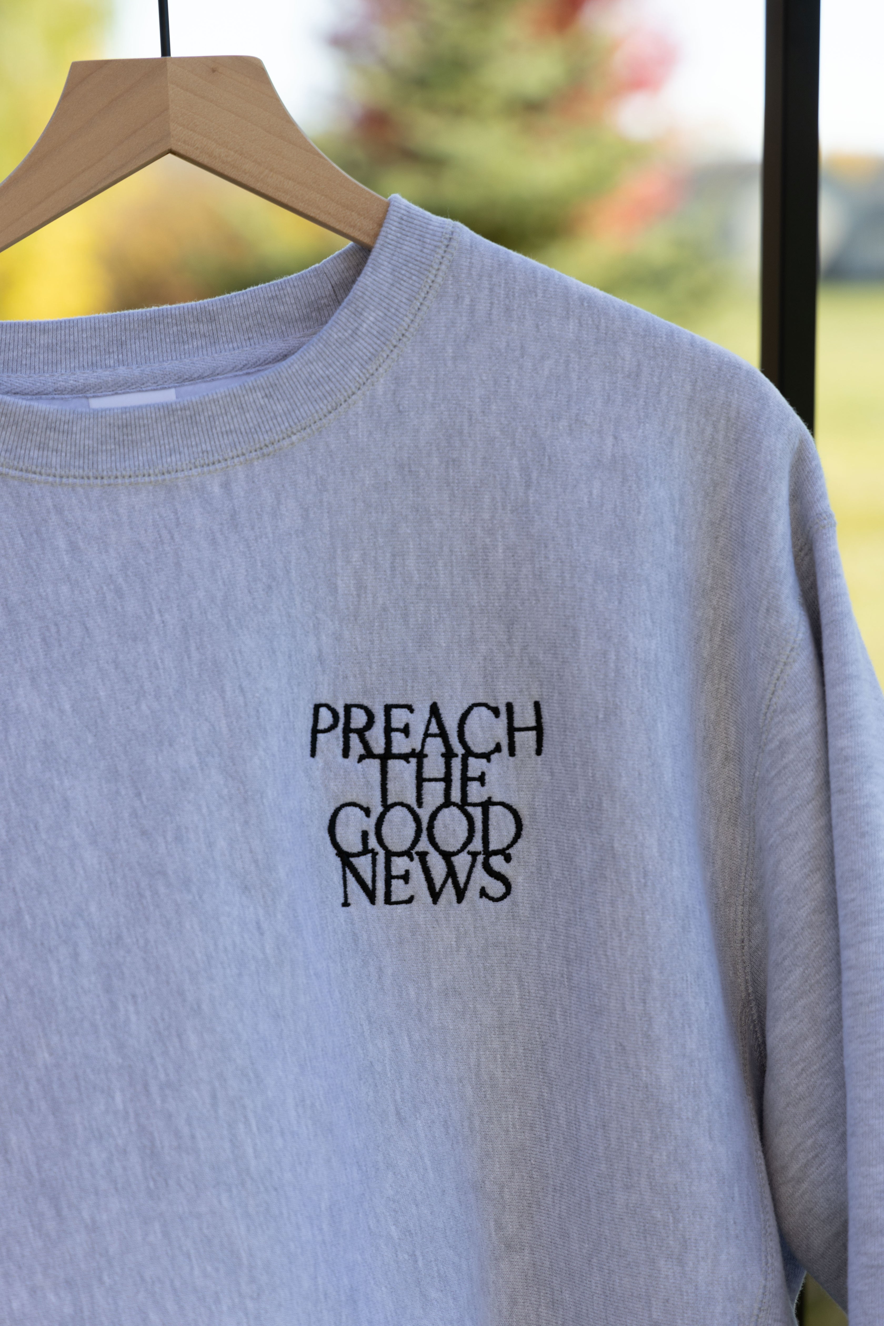 PREACH THE GOOD NEWS PREMIUM CREWNECK gray front embroidery detail