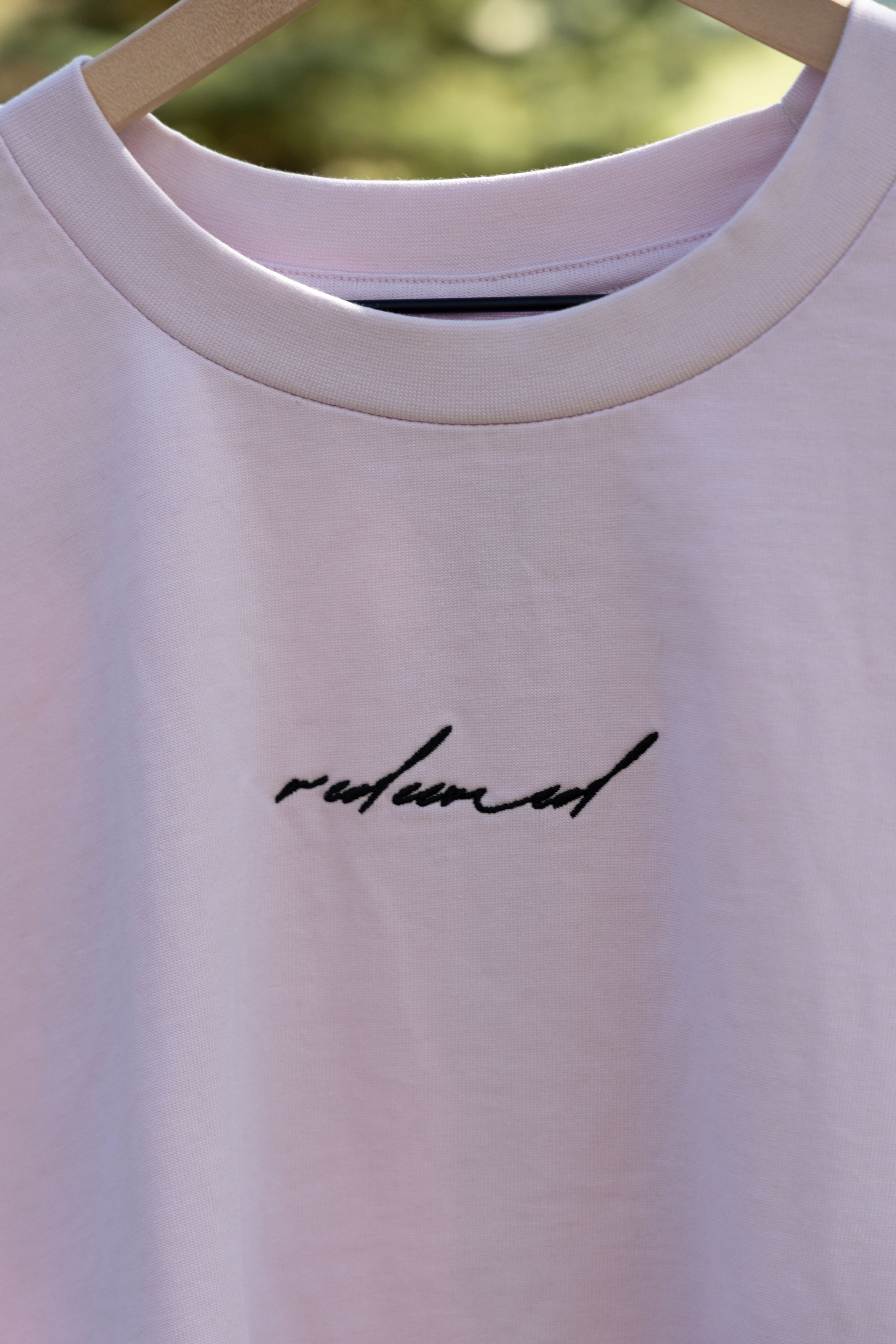REDEEMED TEE purple front embroidery detail