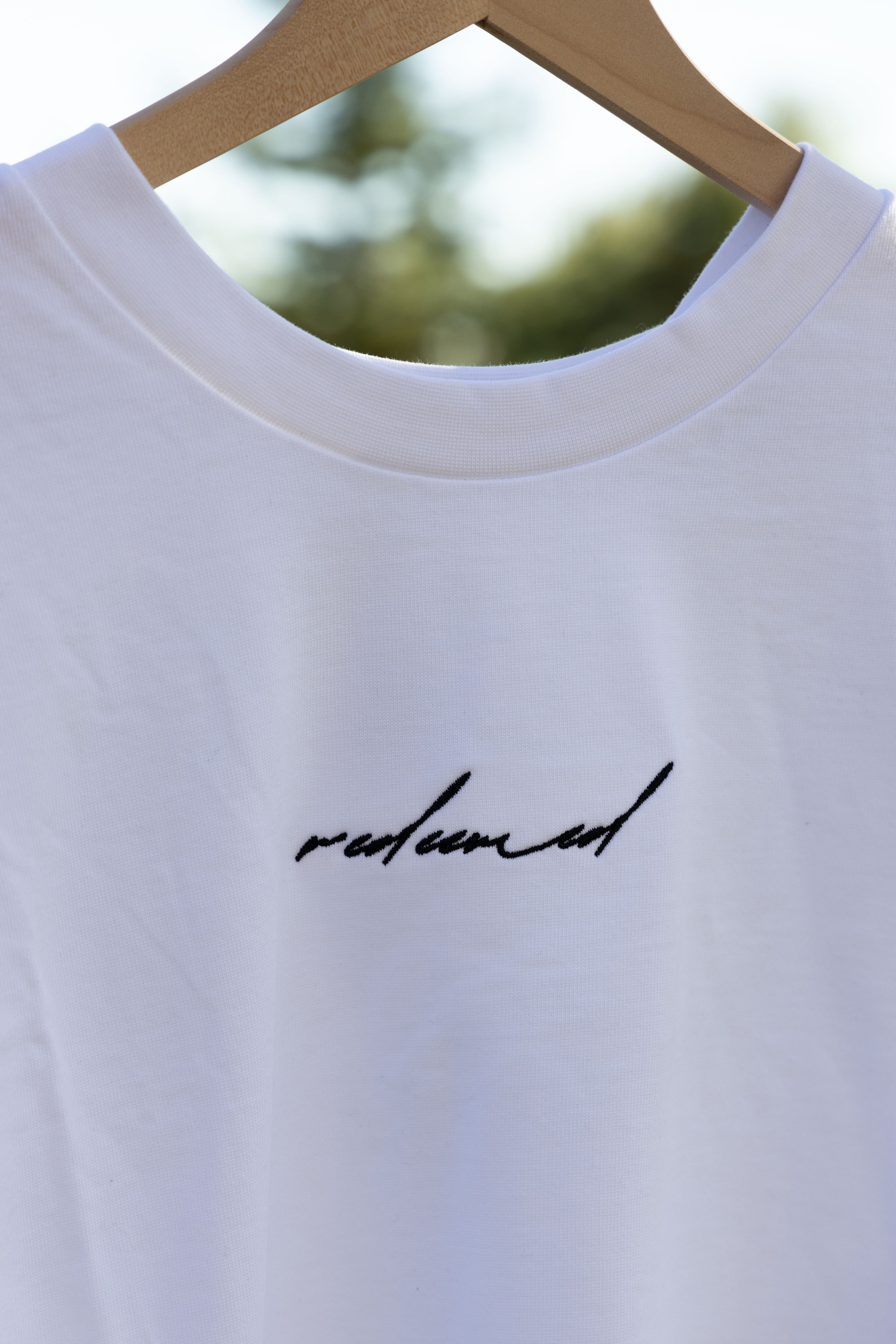 REDEEMED TEE white front embroidery detail