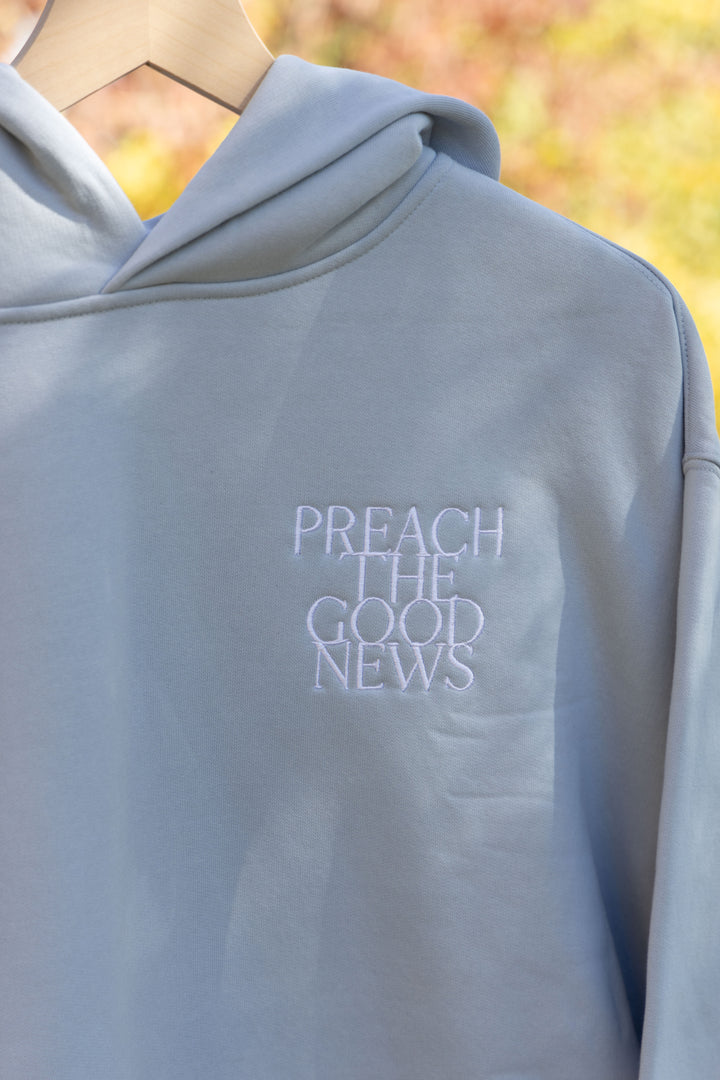 preach the good news hoodie blue front embroidery detail
