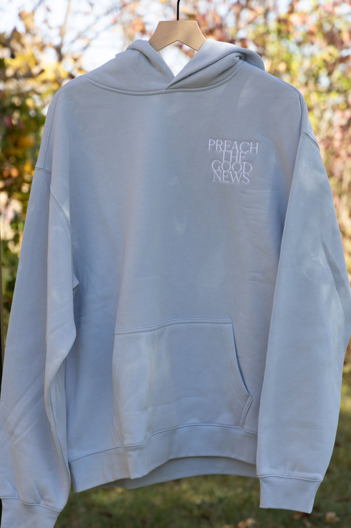 preach the good news hoodie blue front