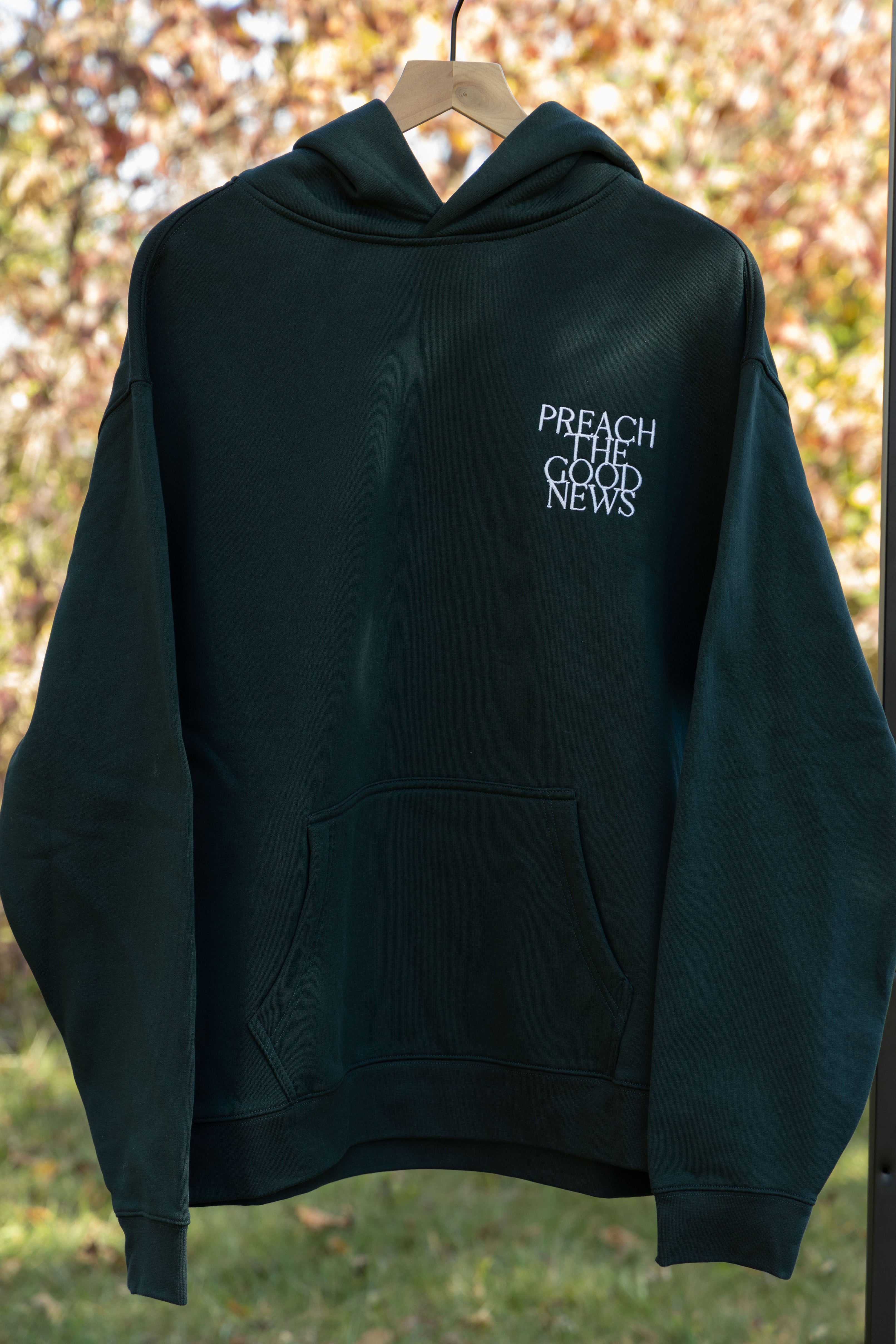 preach the good news hoodie green front