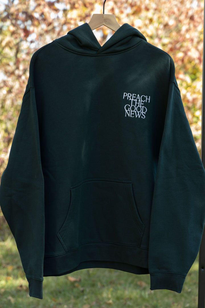preach the good news hoodie green front