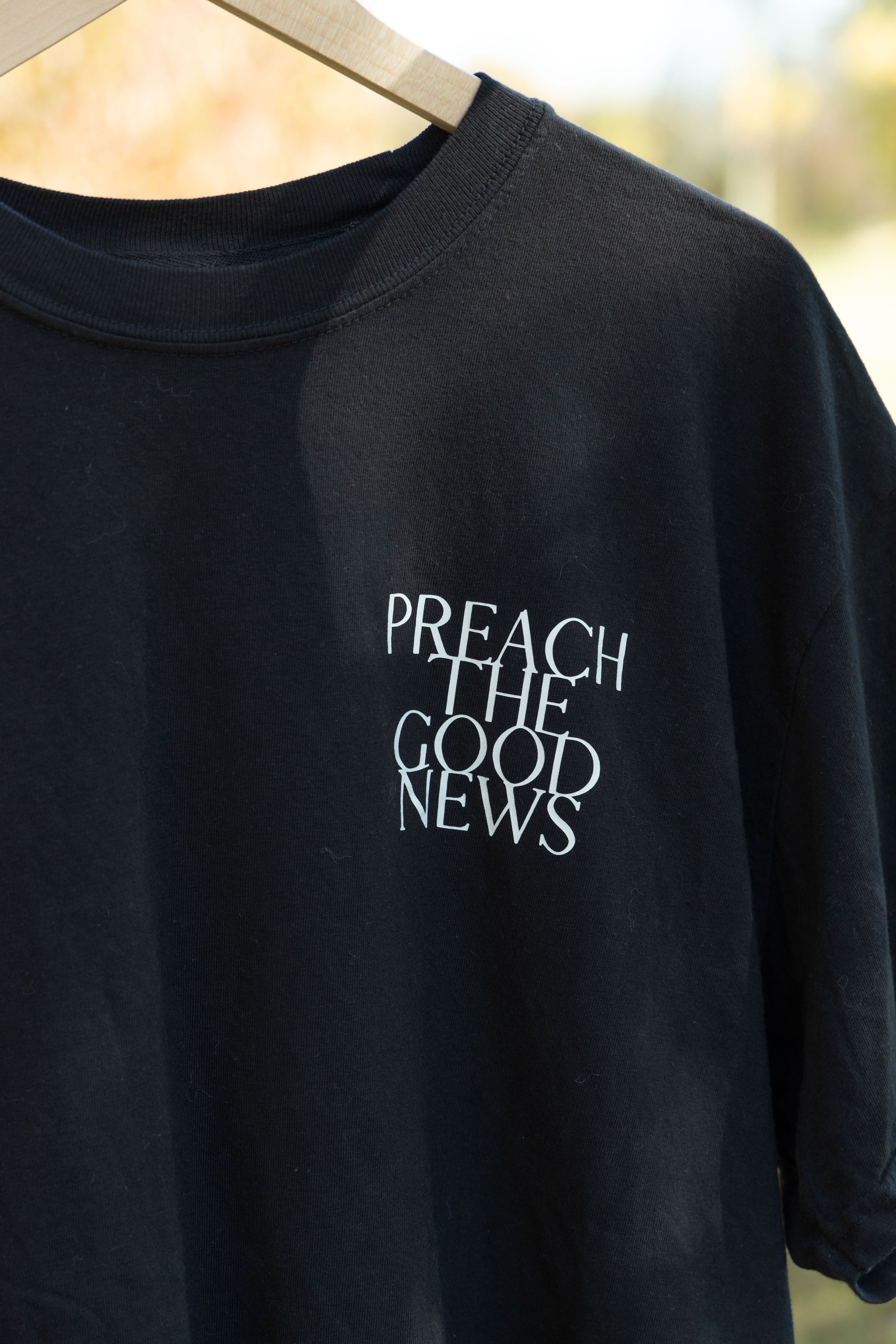 PREACH THE GOOD NEWS TEE black front print detail
